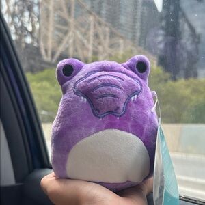 Purple Original Squishmallows Dinosaur Plush Toy named Dove